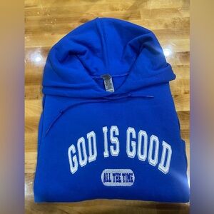 Blue sweatshirt featuring 'God is Good' Puff embroidery